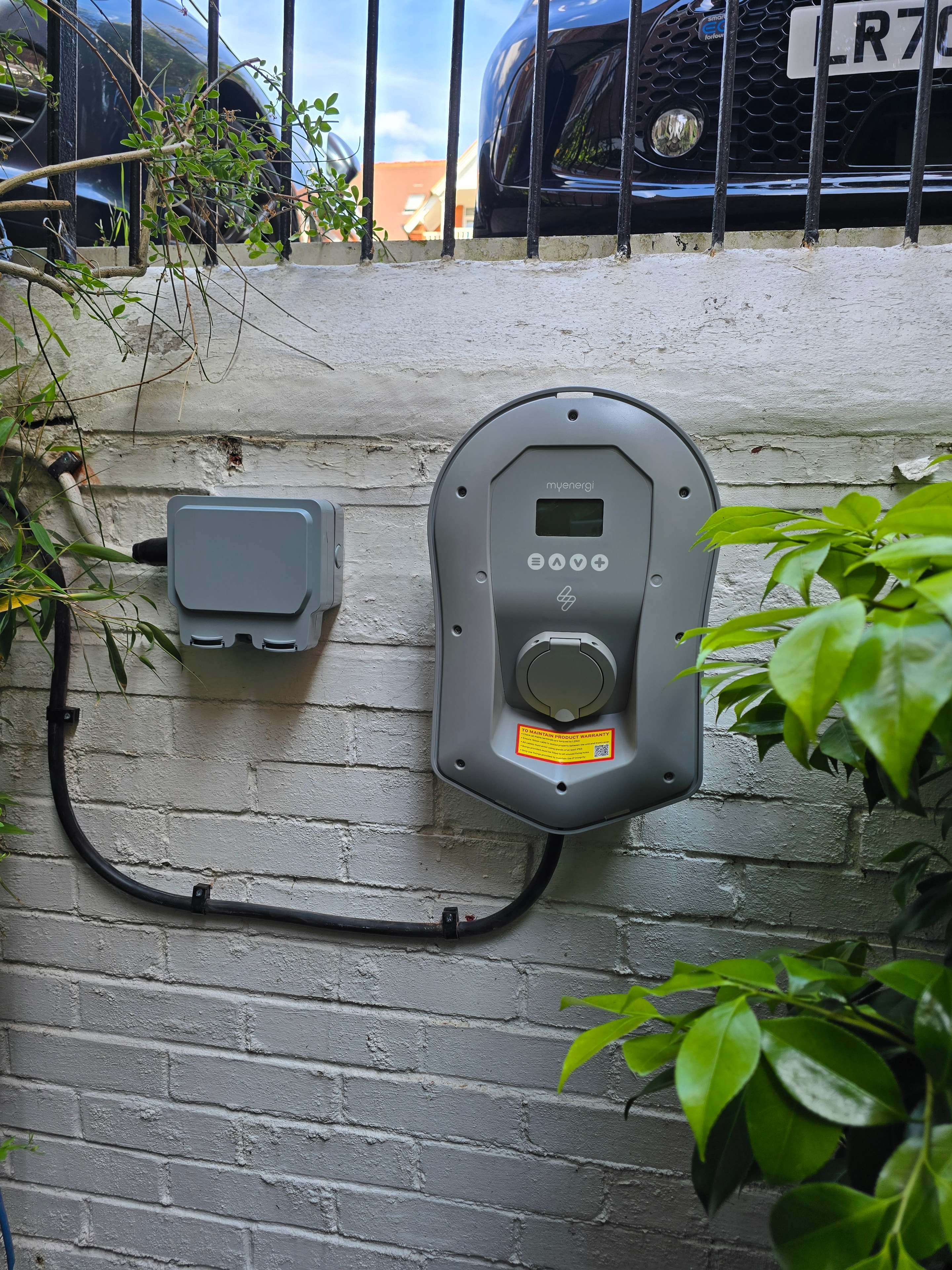 EV charger mounted on exterior wall