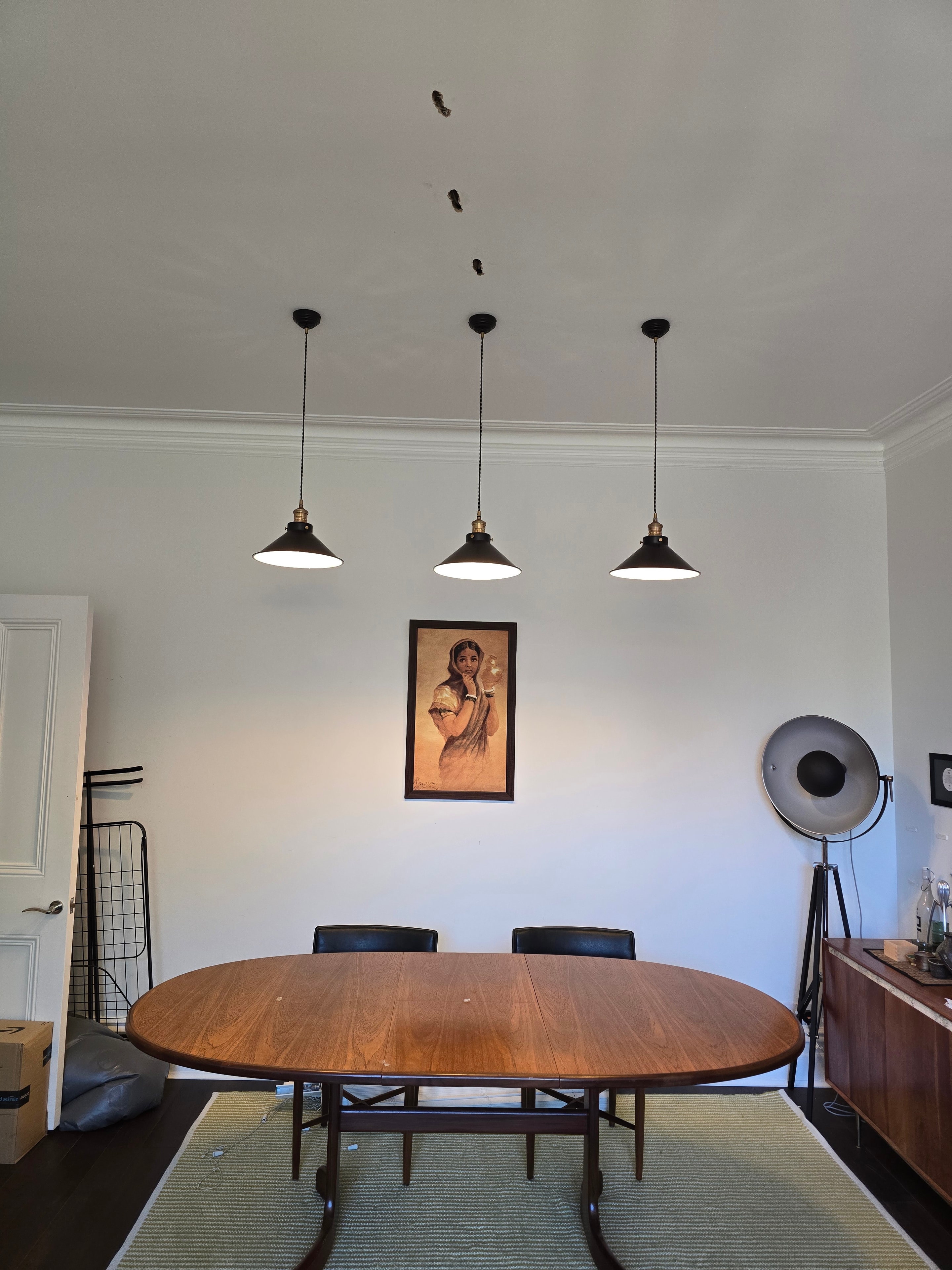 Three pendant lights installed in dining room